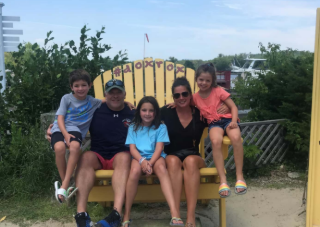 Picture of owner Tim O'Brien with his wife, Kerry, and their children