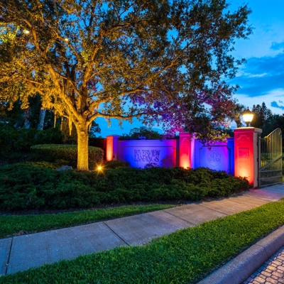 Make your HOA community festive for holidays with color-changing lighting for entrances and landscap Photo