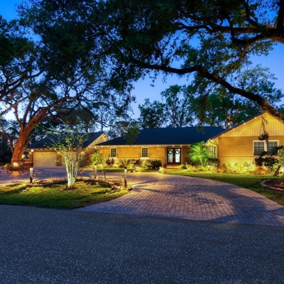 Warm white permanent roofline lighting is perfect year-round for your home. Photo