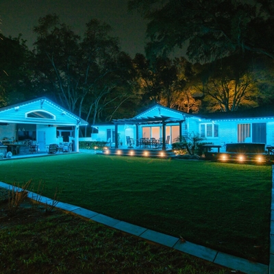 Orange County home with blue permanent roofline lighting Photo