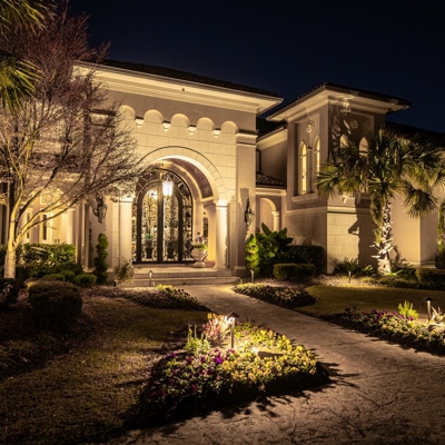 Up lighting and landscape lighting creates a warm ambiance to welcome guests to your home in Miami,  Photo