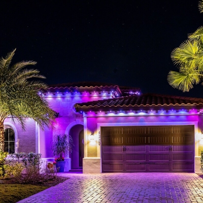 Orange County home with blue and purple permanent roofline lighting Photo