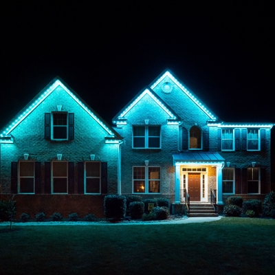 Blue permanent roofline lighting adds to this home&rsquo;s curb appeal Photo