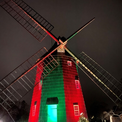 Holiday Lighting on Windmill with Christmas Tree in Front Photo