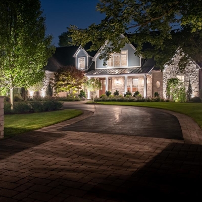 Driveway and Featured Lighting on House Photo