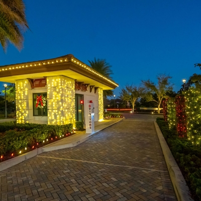 Holiday lighting for your HOA gated entrance makes it festive during Christmas. Photo