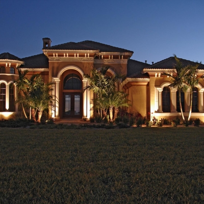 Curb appeal lighting on this Sarasota, FL home add beauty after dark. Photo