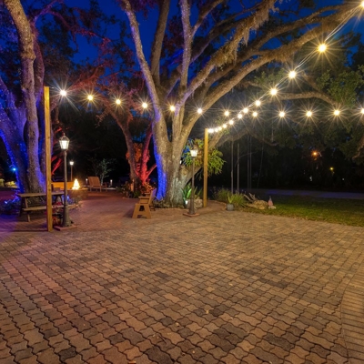 Bistro lighting can add warm white lighting to any patio or outdoor space in Sarasota, Florida. Photo