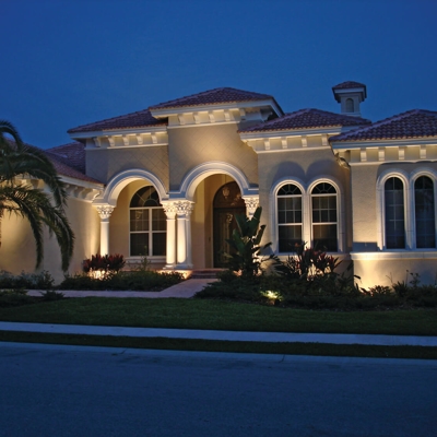 This architectural lighting highlights the features of the home in Florida. Photo