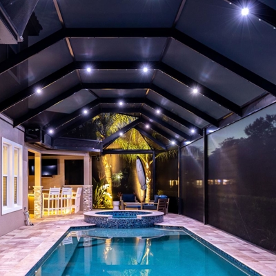 Year-round track lighting adds ambiance to any pool or lanai in your Florida home. Photo