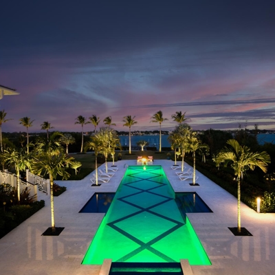 Add landscape lighting around your pool for your hospitality property or resort. Photo