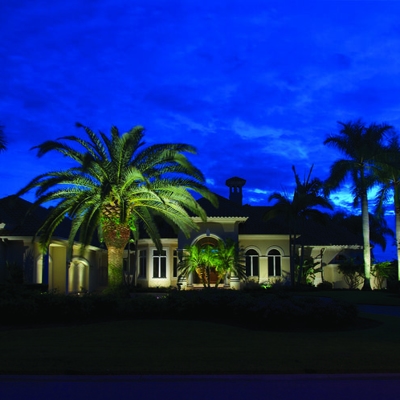 Curb appeal lighting on this Florida home add safety and security after dark. Photo