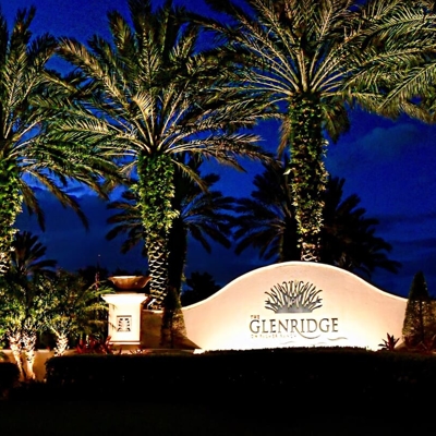 HOA entrance lighting welcomes guests after dark.  Photo