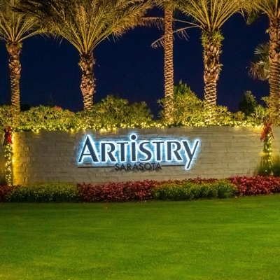  Add garland and bows for your HOA entrance with holiday lighting.  Photo