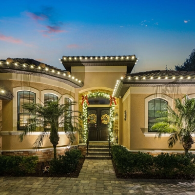 Add roofline lighting and garland for beautiful curb appeal during the holidays.  Photo