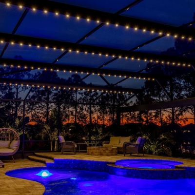 The permanent roofline lighting in this lanai adds ambiance during sunsets in the backyard.  Photo