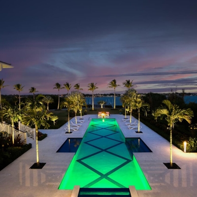 Add landscape lighting around your pool for your hospitality property or resort.  Photo