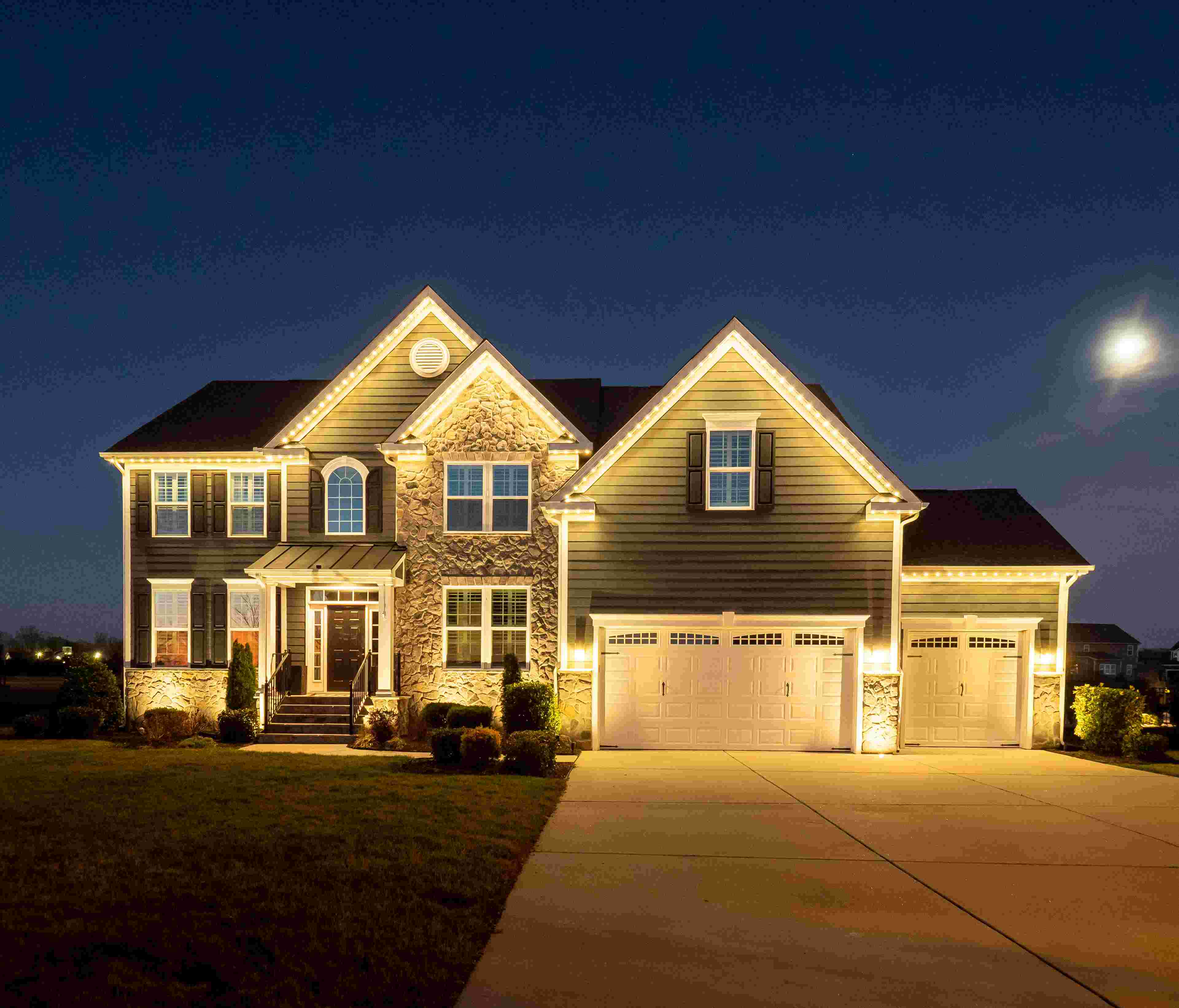 House with white roofline lighting