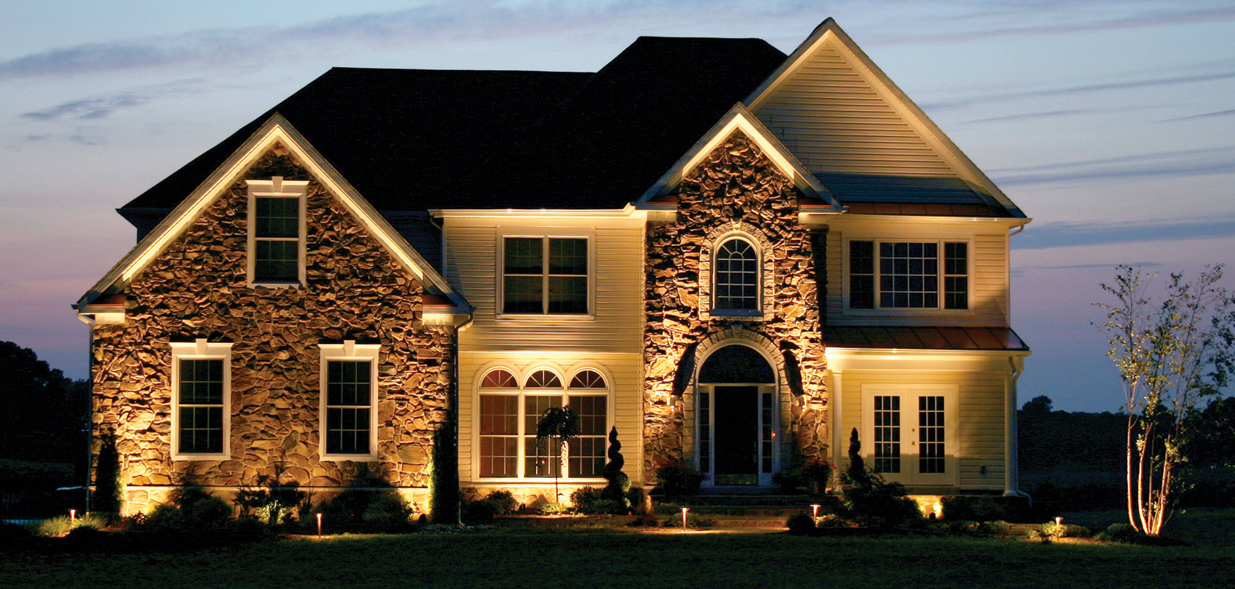 House with exterior lighting installation in Montgomery County, PA
