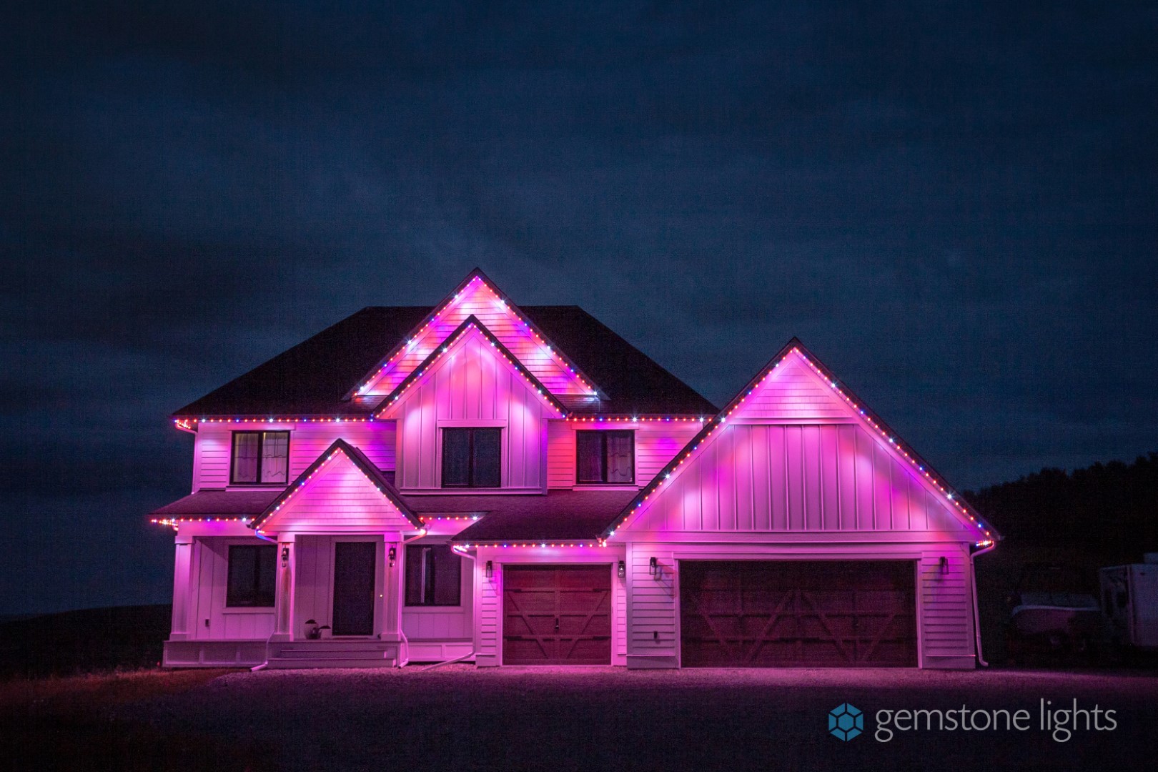 house lit up in pink lighting