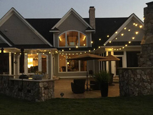Permanent overhead string lighting