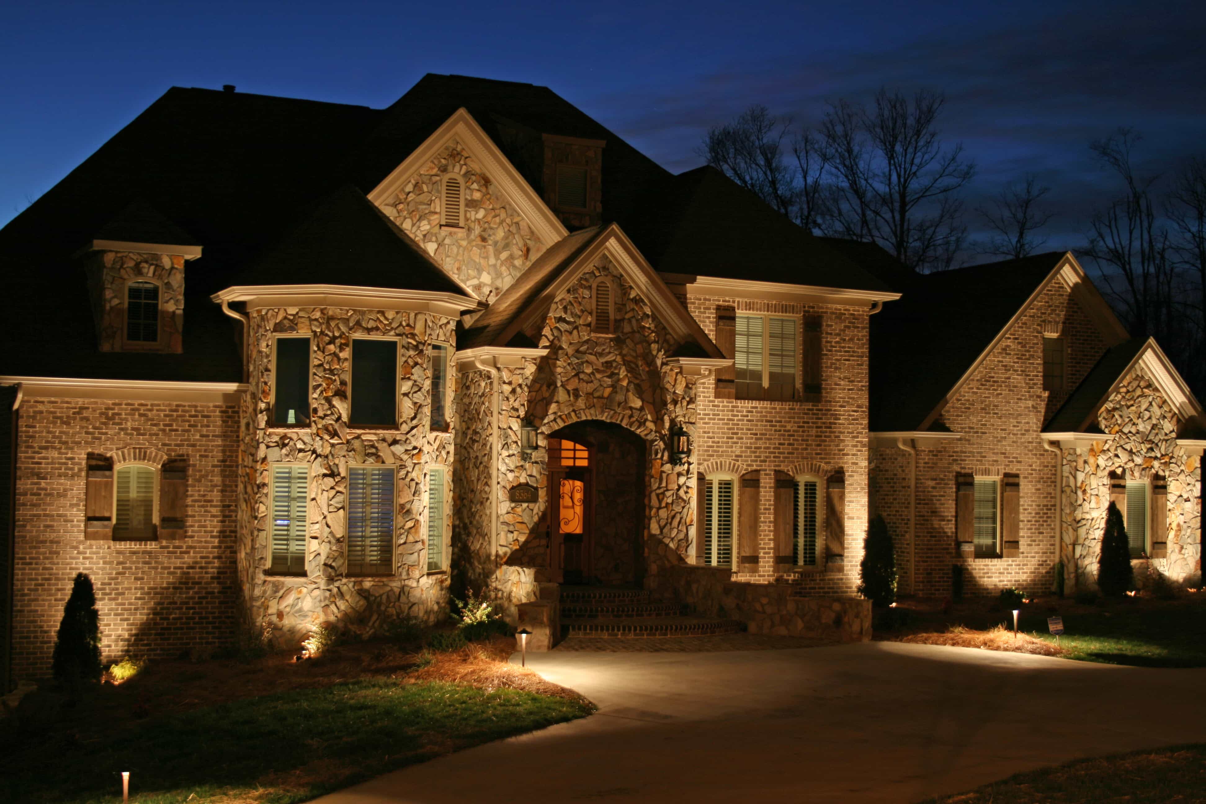 home with custom outdoor lighting