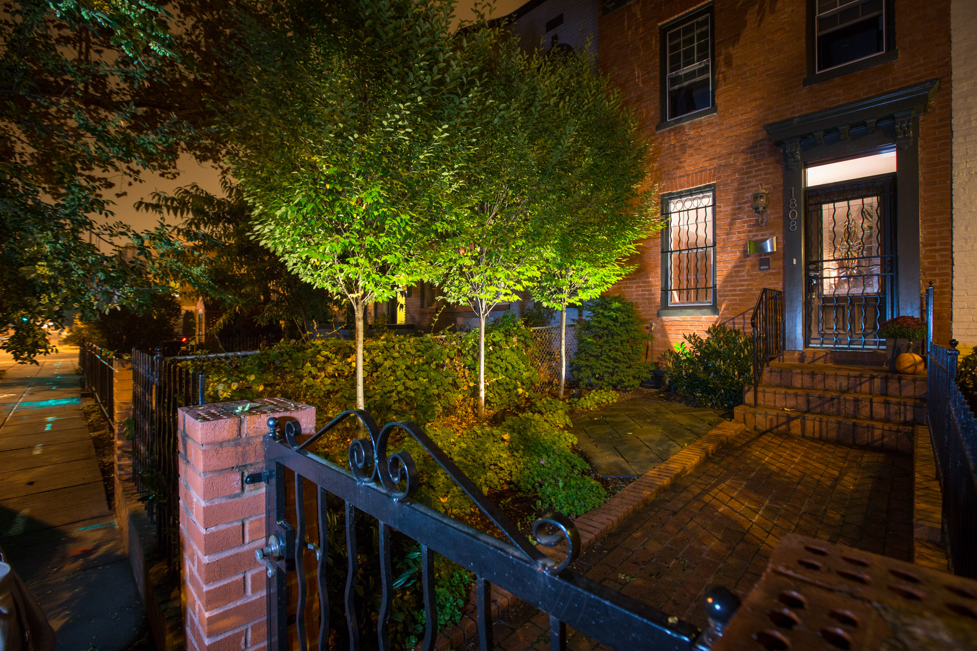 Gated front walkway with lights
