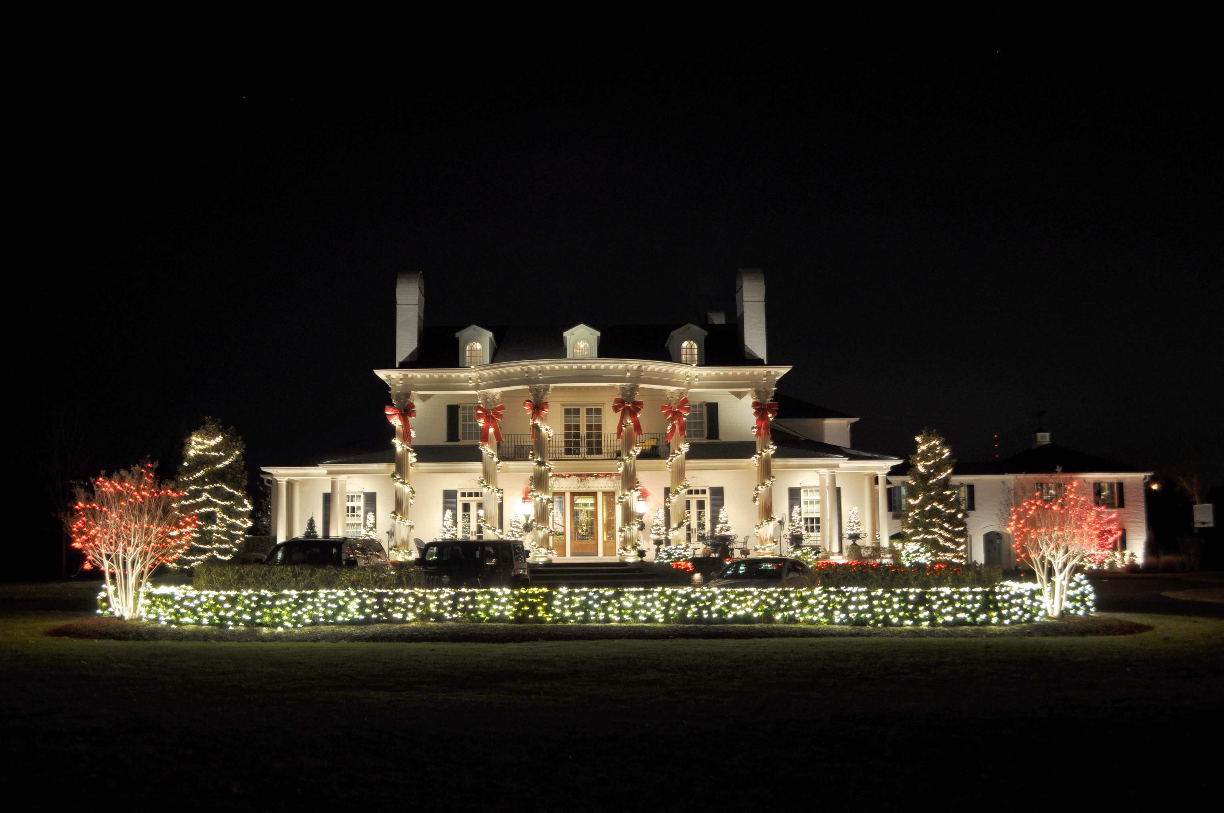 large home with Christmas lighting installed
