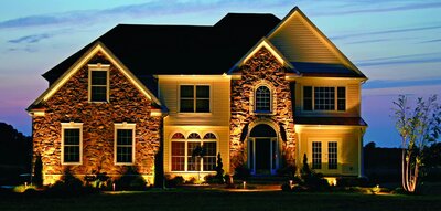 Two-story home with beautiful landscape lighting