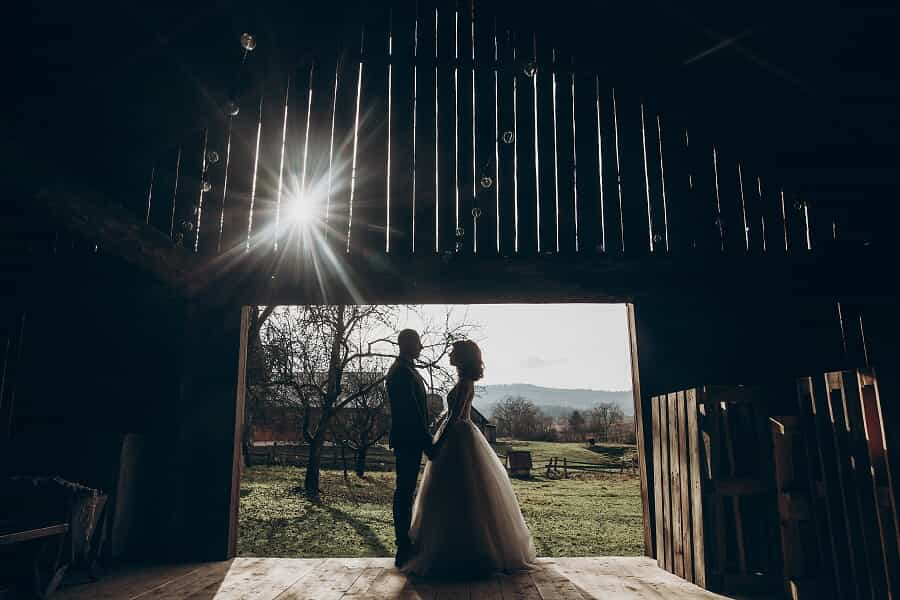 couple getting married in a barn