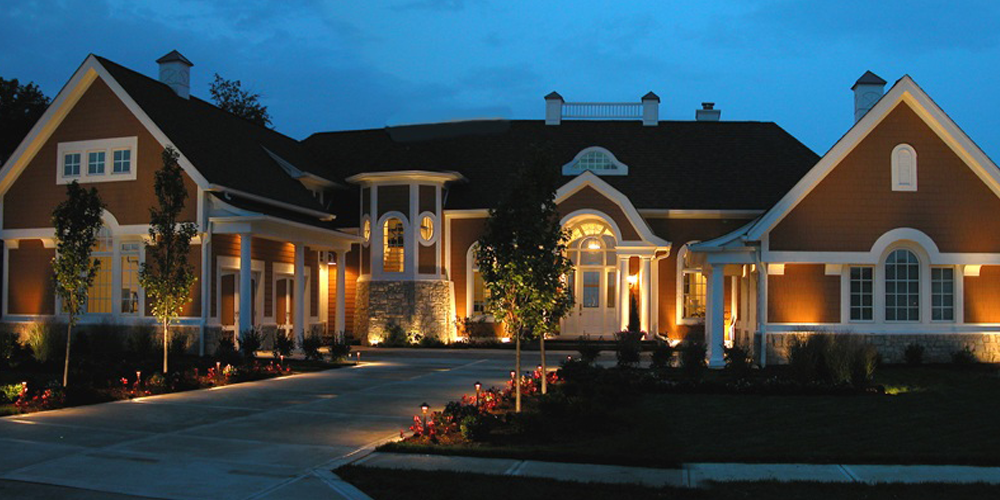 home with outdoor lighting installed