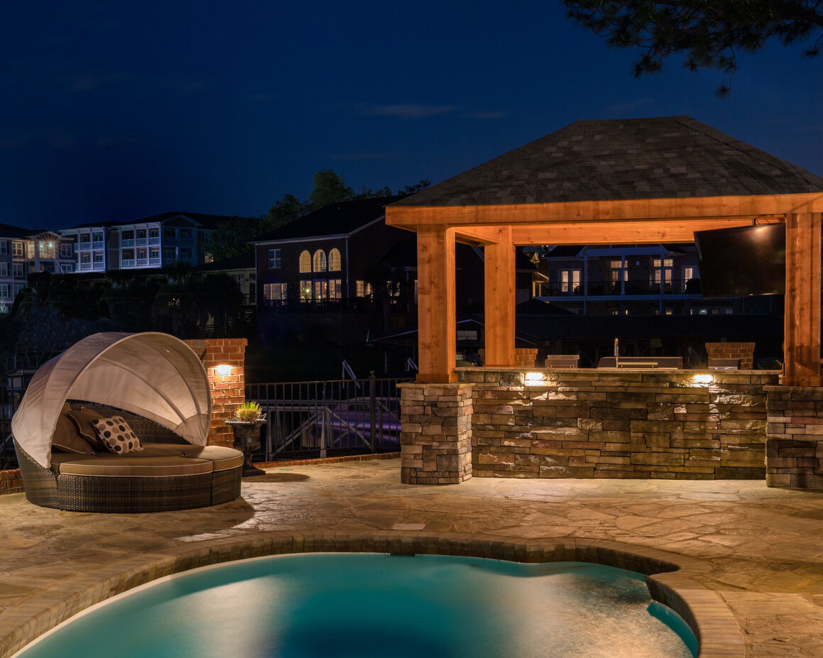 Outdoor pool area with lighting