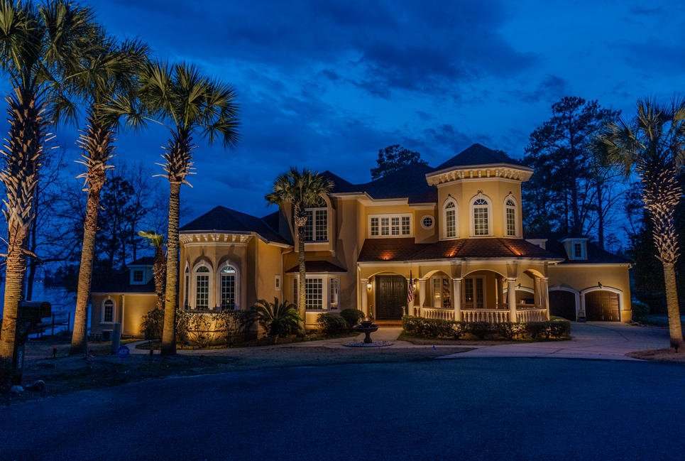 front of house illuminated with outdoor lighting