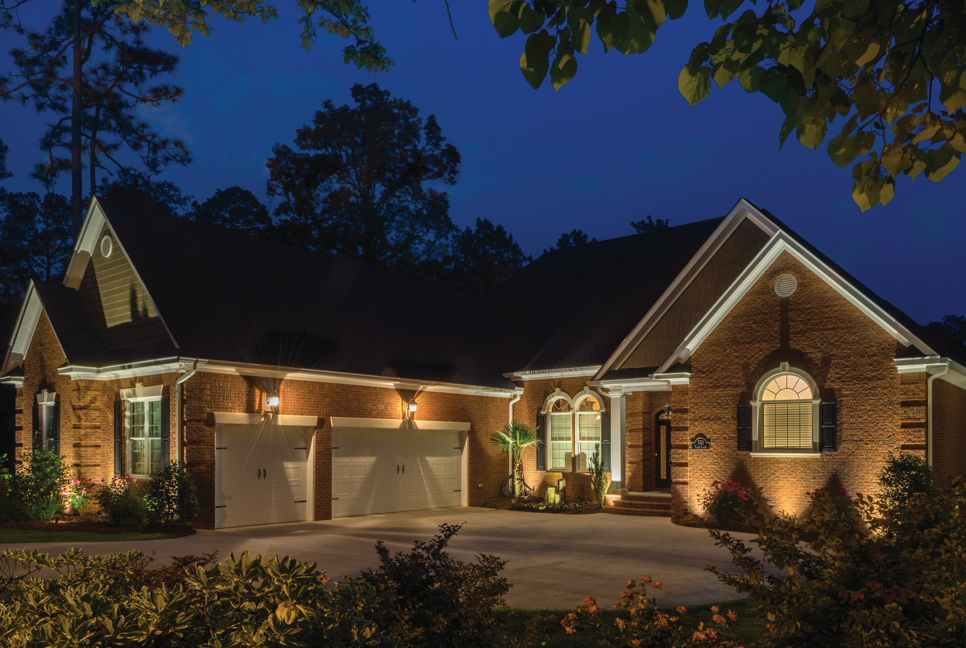 front of house illuminated with outdoor lighting