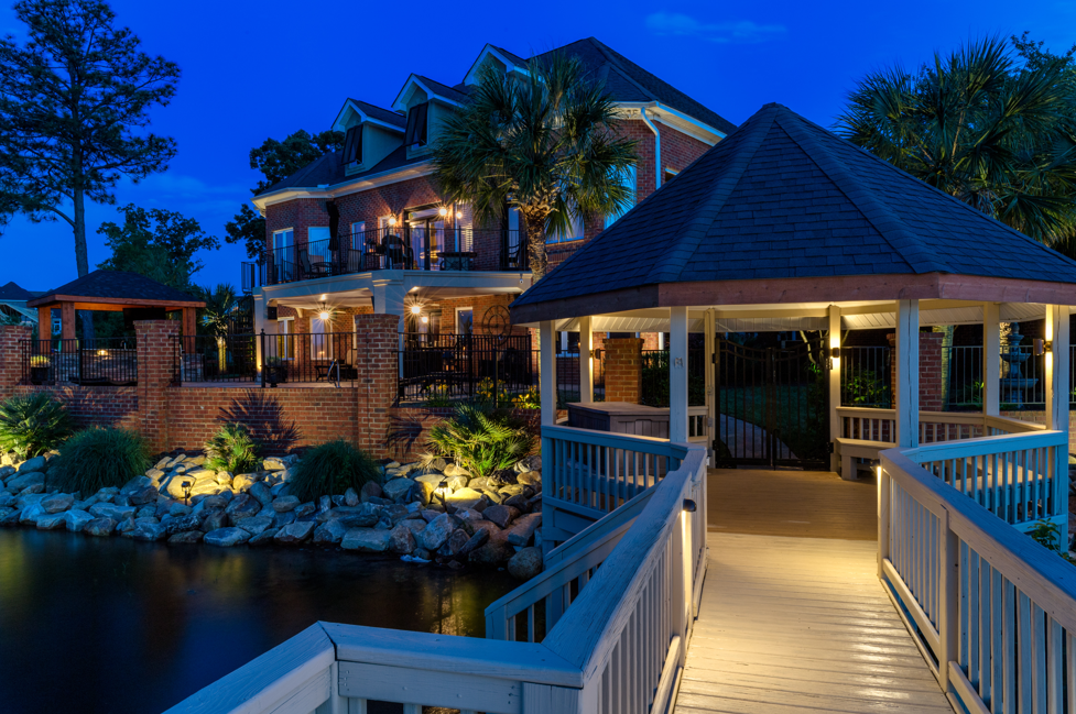 front of house illuminated with outdoor lighting