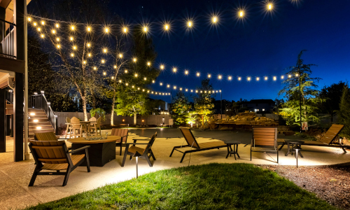 string lights over patio at night