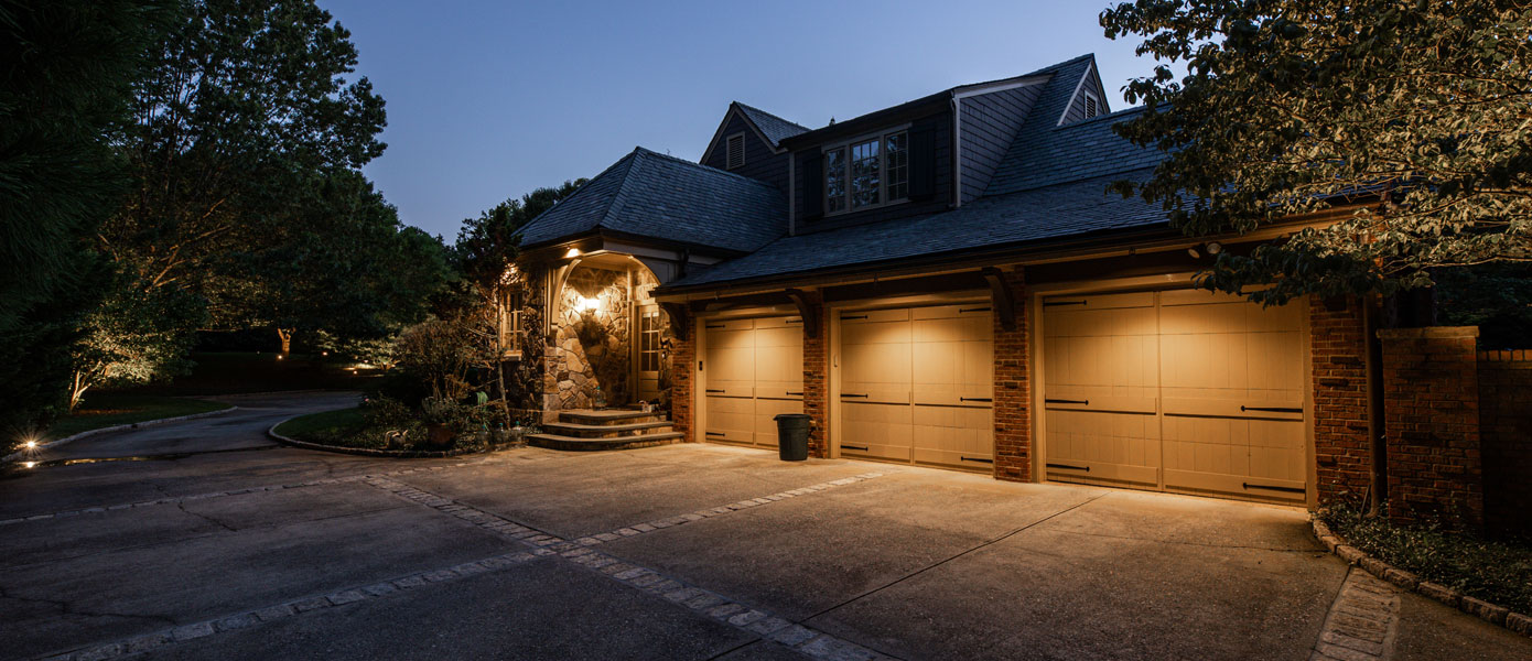 A garage with lights on the garageDescription automatically generated
