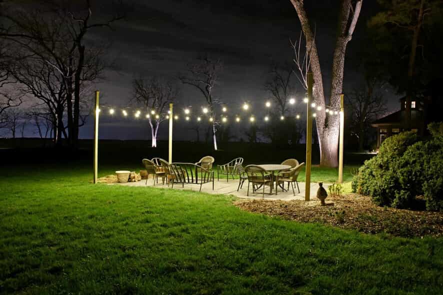 Outdoor patio & dining area with string lighting