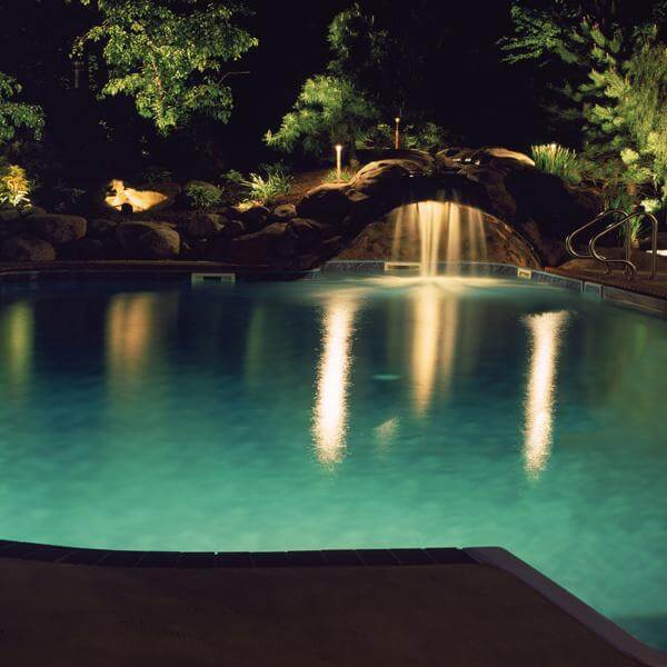 Backyard pool with beautiful lighting