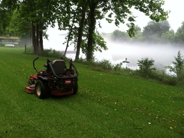 Lawn mower machine on the grass