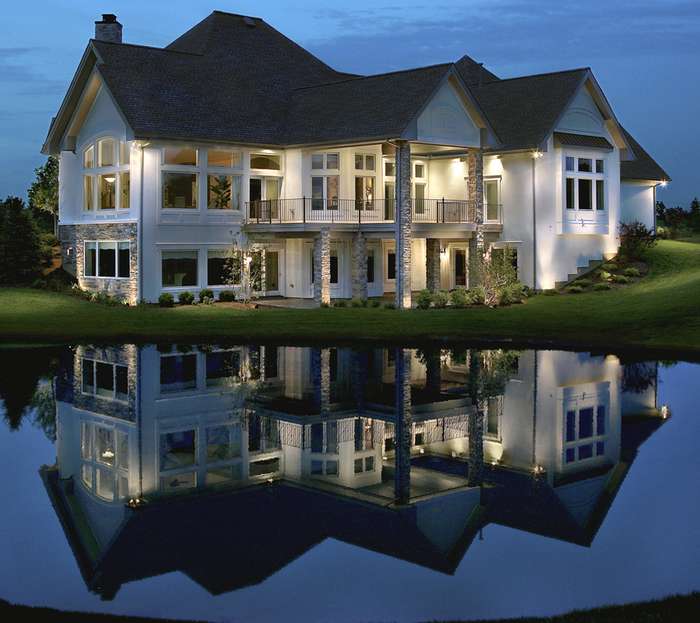 House beside lake with lights