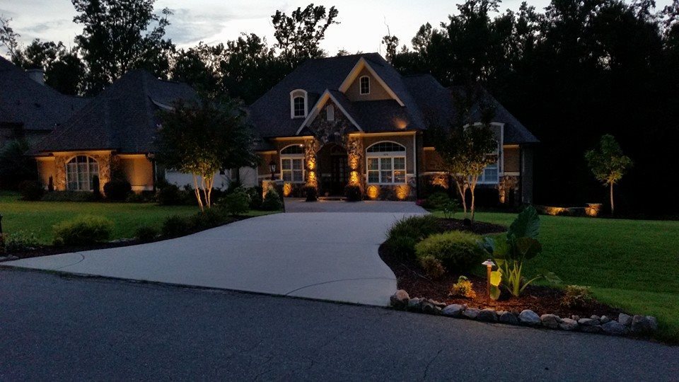 Front yard and driveway with lighting
