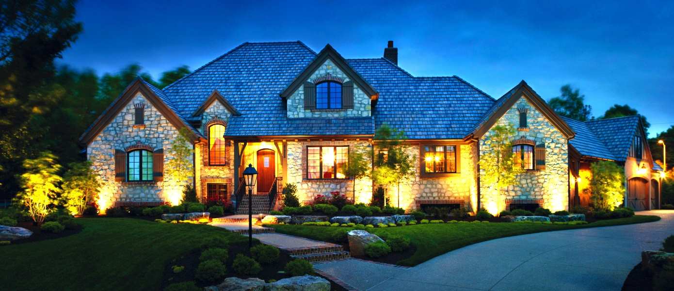 home with outdoor lighting