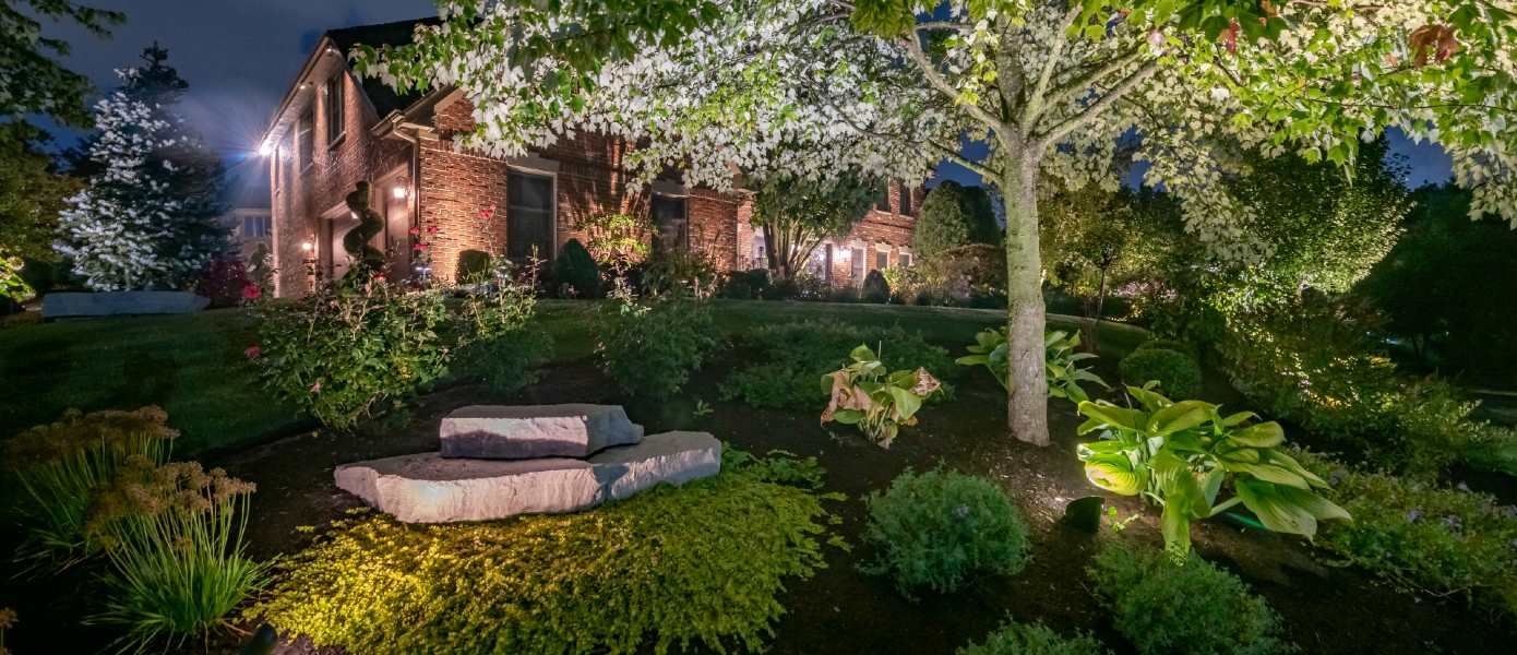 house with custom landscape lighting in Raleigh, NC