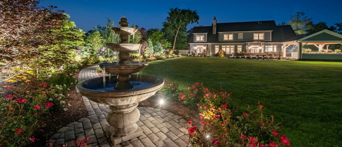 house with custom landscape lighting in Raleigh, NC