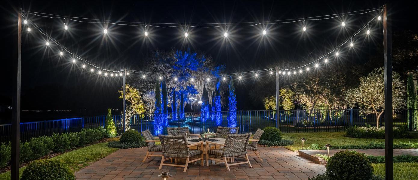 hanging outdoor lights over seating area