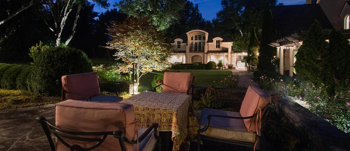 A table and chairs outside of a house