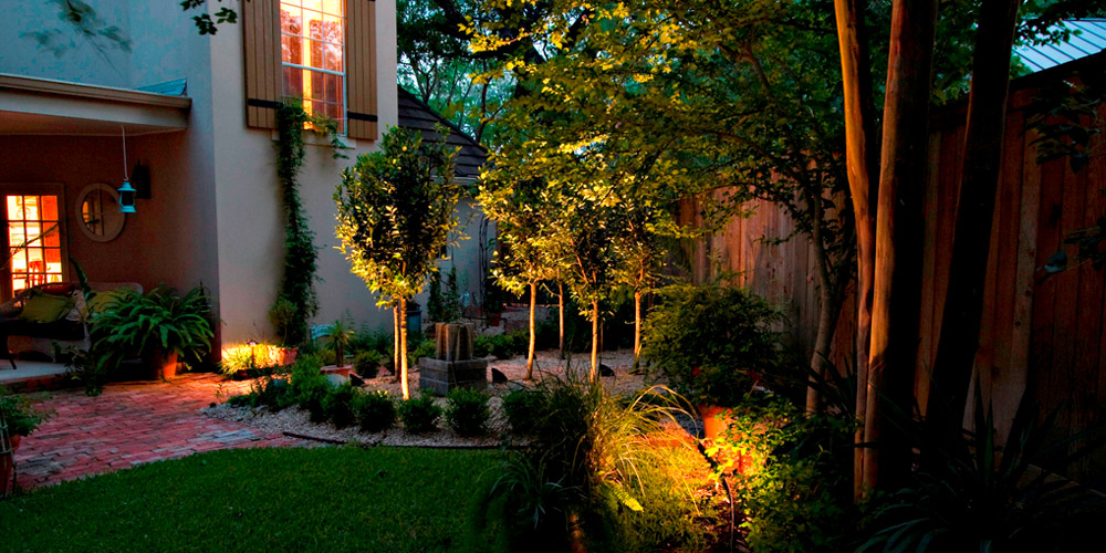 Backyard and patio with specialty lighting