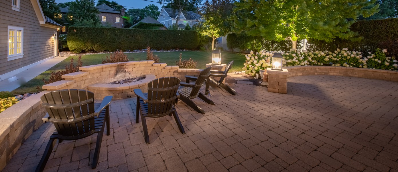 Photo of backyard with outdoor lighting