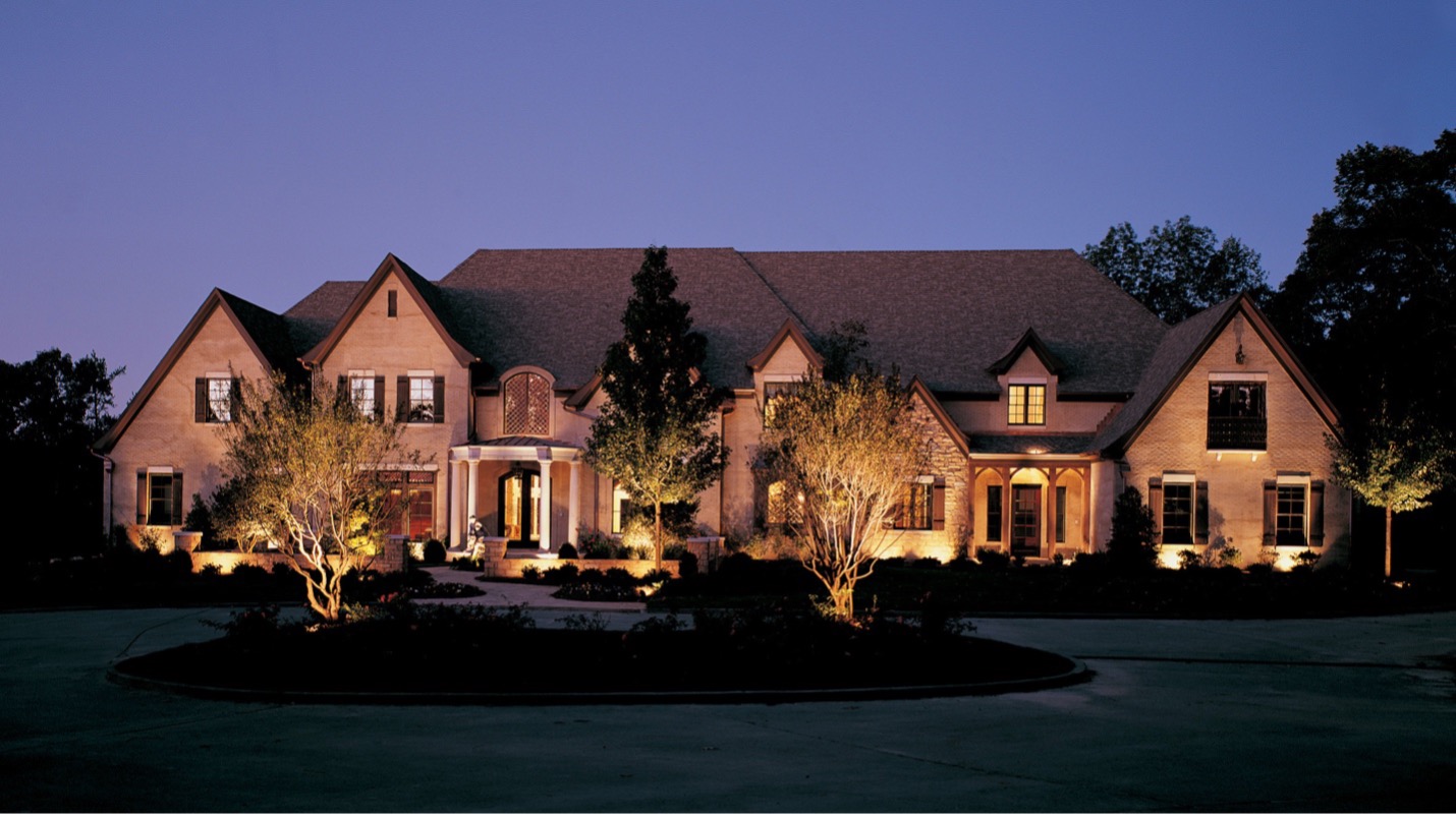 large house with outdoor flood lights